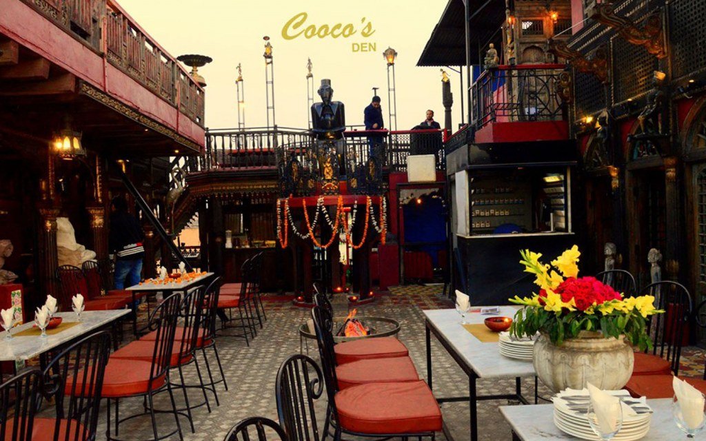 Cooco's Den Fort Road Food Street — heritage restaurant with Badshahi Mosque view